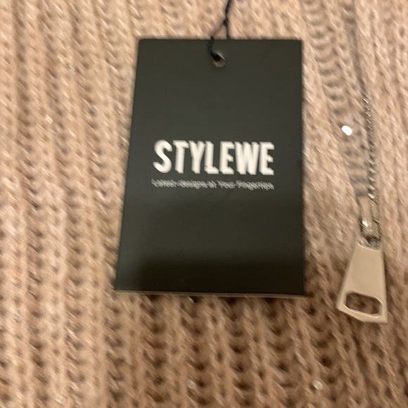 It’s a beautiful sweater with sequins in a beige color. - Picture 7 of 7